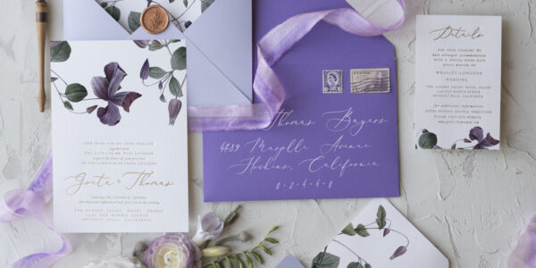 Lavender wedding invitations, lavender wedding cards, lilac wedding invitations, lila wedding invitations, purple wedding invitations, purple envelope, purple ribbon, lavender ribbon, white card, lavender and white wedding invitations, white wedding invitations, envelope addressing, white calligraphy, silk bow, clematis, clematis flower, clematis wedding invitations, gold lettering, gold calligraphy, elegant wedding invitations