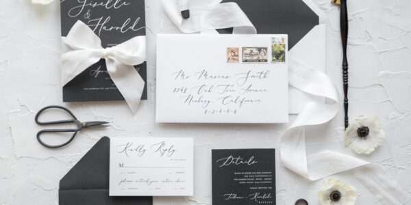 Black wedding invitations, white wedding invitations, black and white wedding invitations, black and white wedding, black wedding, white wedding, black wedding stationery, white wedding stationery, black wedding accessories, white wedding accessories, white ribbon, white bow, envelope addressing, white card, black card, gothic wedding, elegant wedding invitations