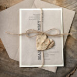 Recycled wedding invitations, eco paper wedding invitations, eco wedding invitations, eco paper, ecofriendly paper, recycled paper, handmade wedding invitations, affordable wedding invitations, cheap wedding invitations, burlap, burlap twine, ecru wedding invitations, ecru card, rustic wedding invitations, black lettering, wooden heart, rustic wedding, rustic wedding cards