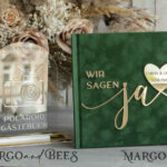 Capturing Cherished Moments: The Luxurious Velvet Emerald Wedding Guest Book Adorned with Gold Lettering