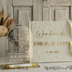 Gather Timeless Memories with a Velvet Ecru Wedding Guest Book Adorned in Pearls and Gold