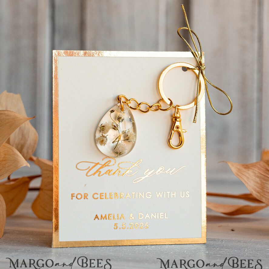 Gold Keychain Wedding Favors: Teardrop Design with White Flowers and Ivory Golden Card