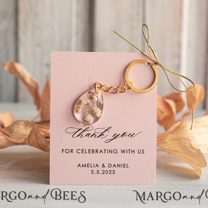 Gold Keychain Wedding Favors: Teardrop Design with White Flowers and Pink Thank You Card